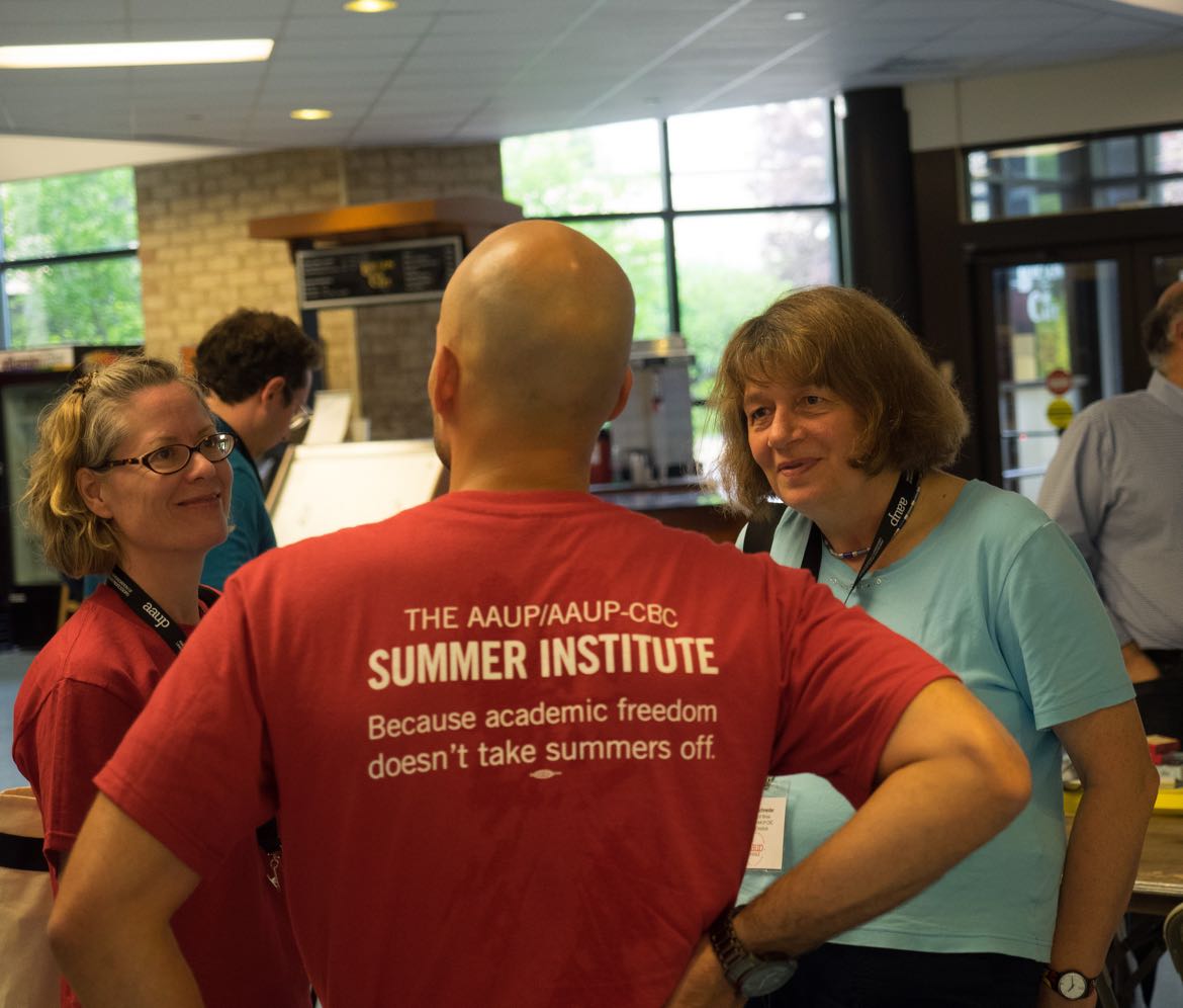 Man wearing t-shirt from AAUP summer institute.